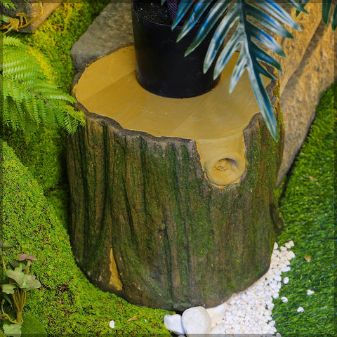 Rustic tree stump with moss for garden