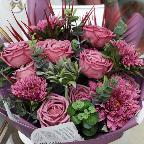 silk flower bouquet with daisies and roses