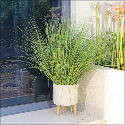 Decorative faux grass plant