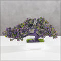 Artificial bonsai plant with purple green leaves