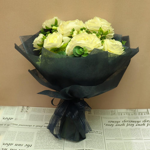 ranunculus flowers with faux eucalyptus