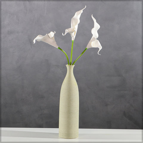 Decorative artificial white calla lilies