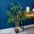 Artificial bamboo plant 110cm high in a modern living room setting