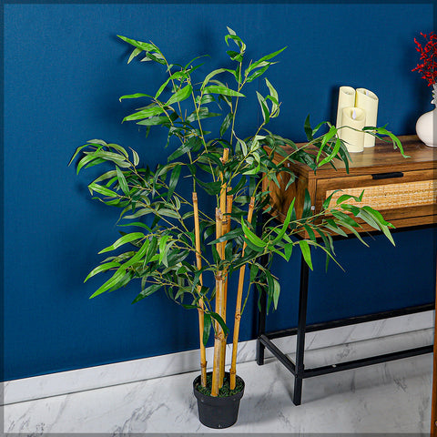 Artificial bamboo plant 110cm high in a modern living room setting