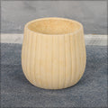 Stylish round concrete planter with ribbed design