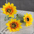 fake sunflowers in vase