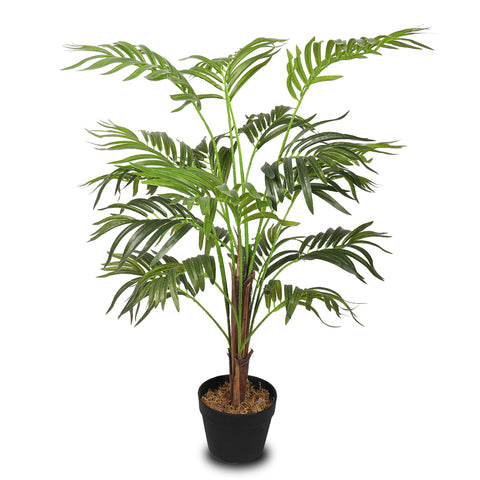 Fake indoor palm with lush leaves in a stylish pot