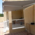 Large retractable balcony awning for sun protection