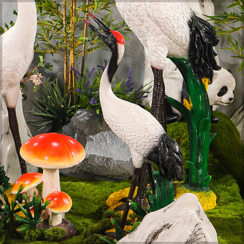 Garden flamingo statue near flowers