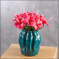 Modern blue vase with a glossy finish