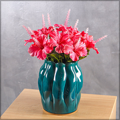 Modern blue vase with a glossy finish