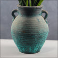 Elegant small clay jar with handle