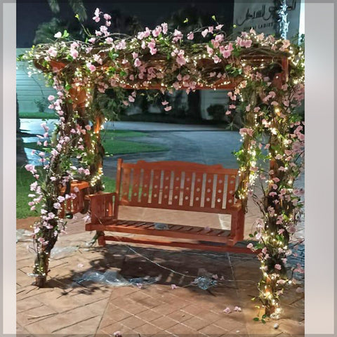Swing with artificial flowers
